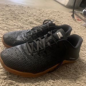 Nike metcon black with gum sole.